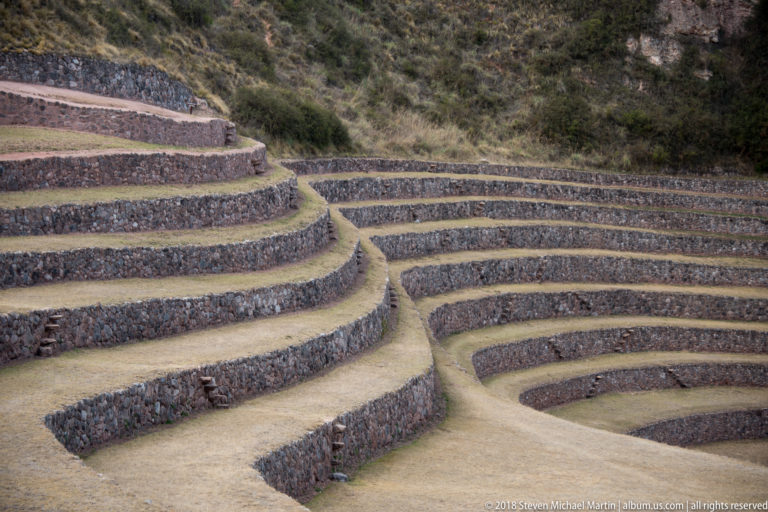 Curved terrace systems meeting around a narrow raised division at Moray, with tighter concentric rings descending at right.