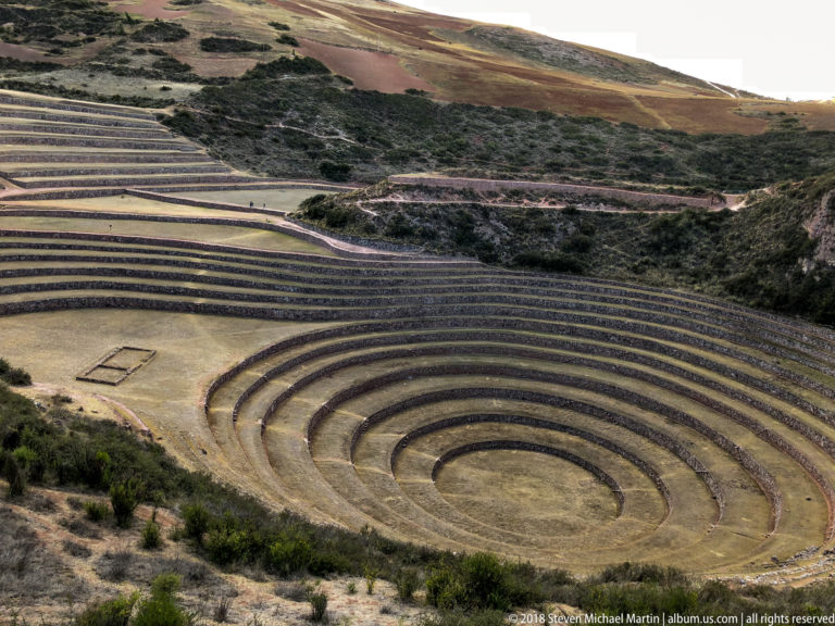 Elevated Moray terraces with a rectangular ground outline on a flat level left of the main concentric rings.