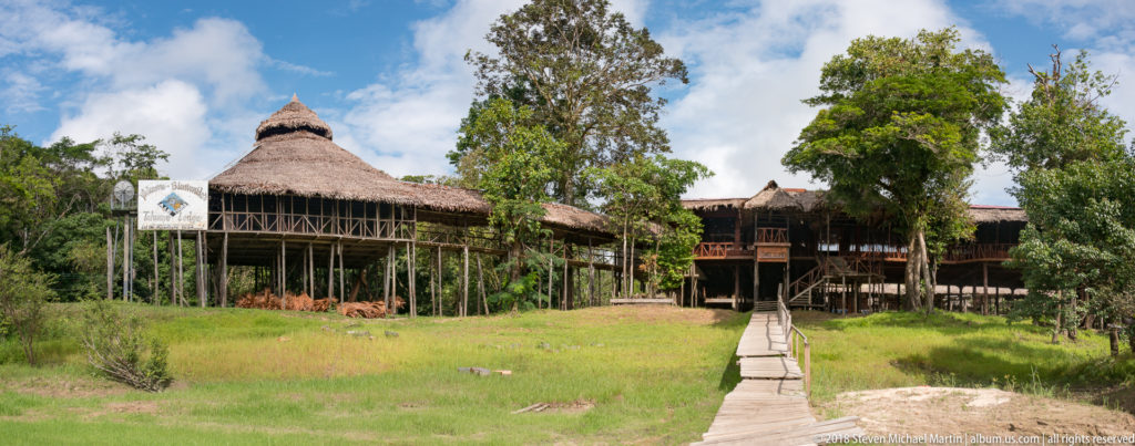 Thatched pavilion and elevated walkways at Tuhauyo Lodge.