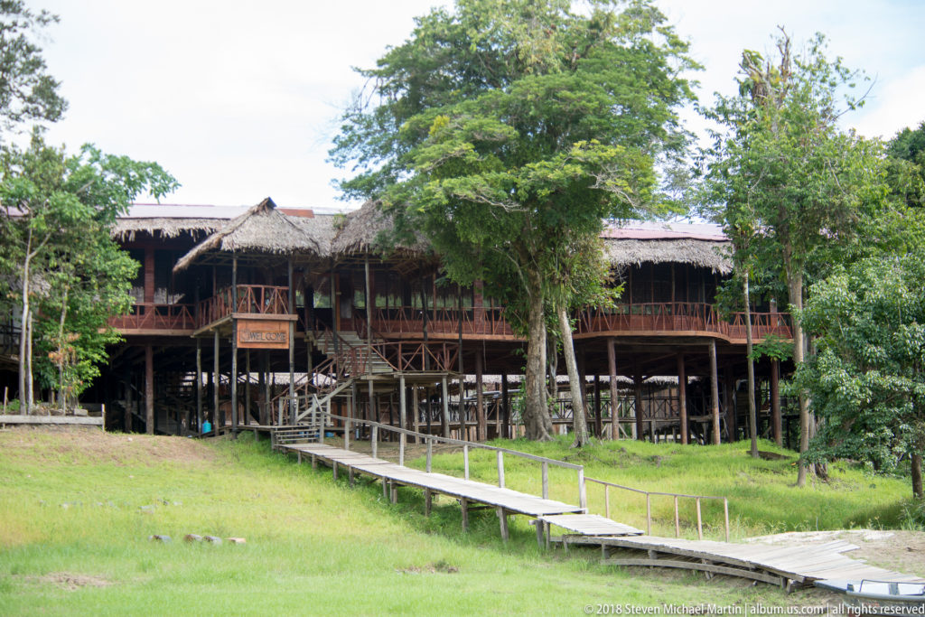 Wide establishing view of elevated complex at Tuhauyo Lodge.