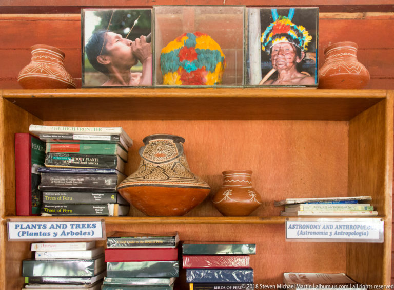 Natural-history books, pottery, and photographs at Tuhauyo Lodge.