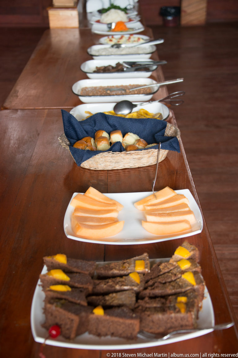 Assorted breads, cheese, and grilled food at Tuhauyo Lodge.