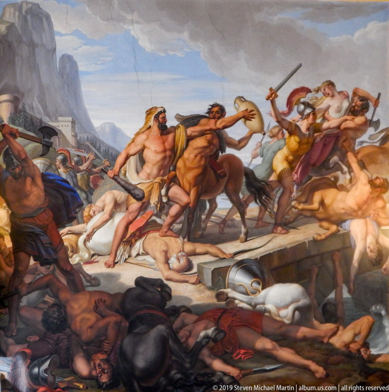 Large framed or ceiling painting with multiple figures in a richly decorated Pitti Palace interior.