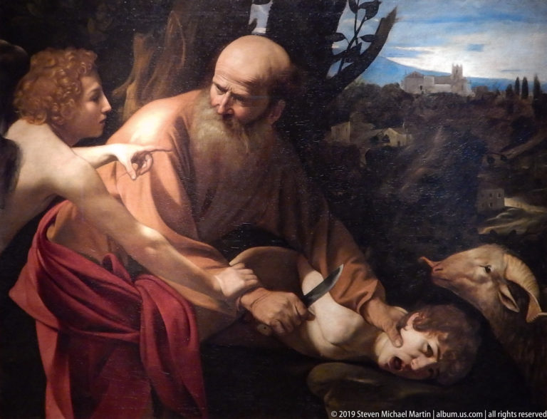 Caravaggio’s Abraham restrains Isaac with a knife as an angel grips his wrist and indicates the sacrificial ram.