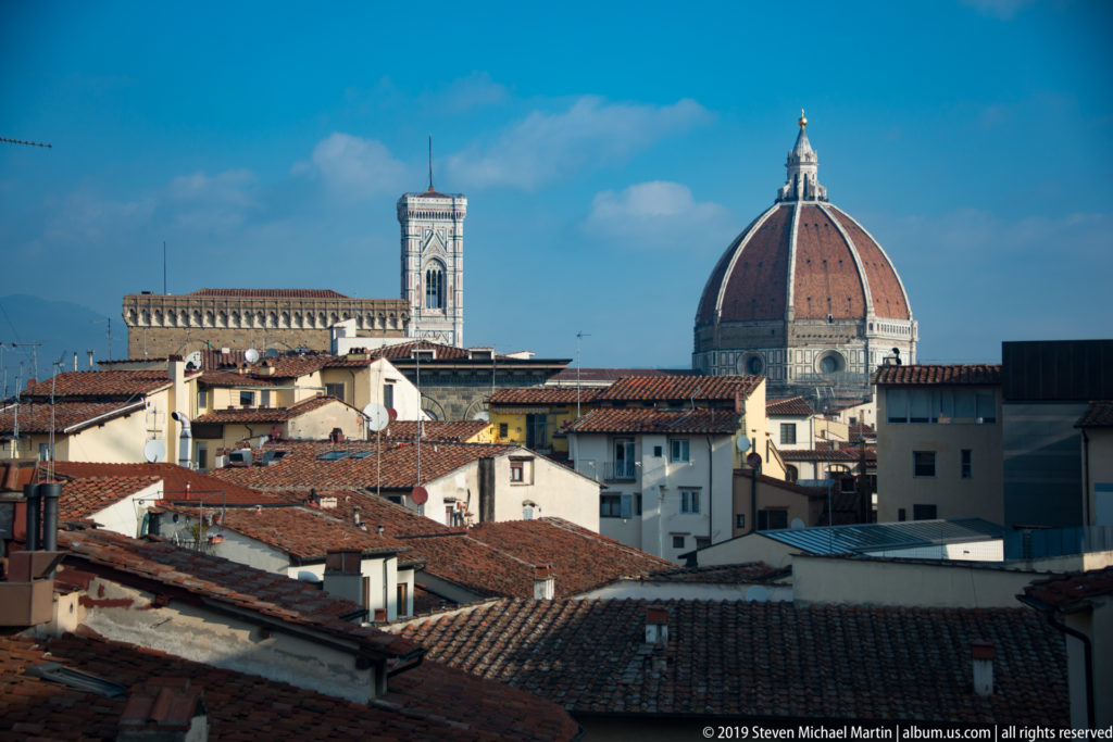 Florence rooftops with the dome of Santa Maria del Fiore at right and Giotto’s Campanile to the left.