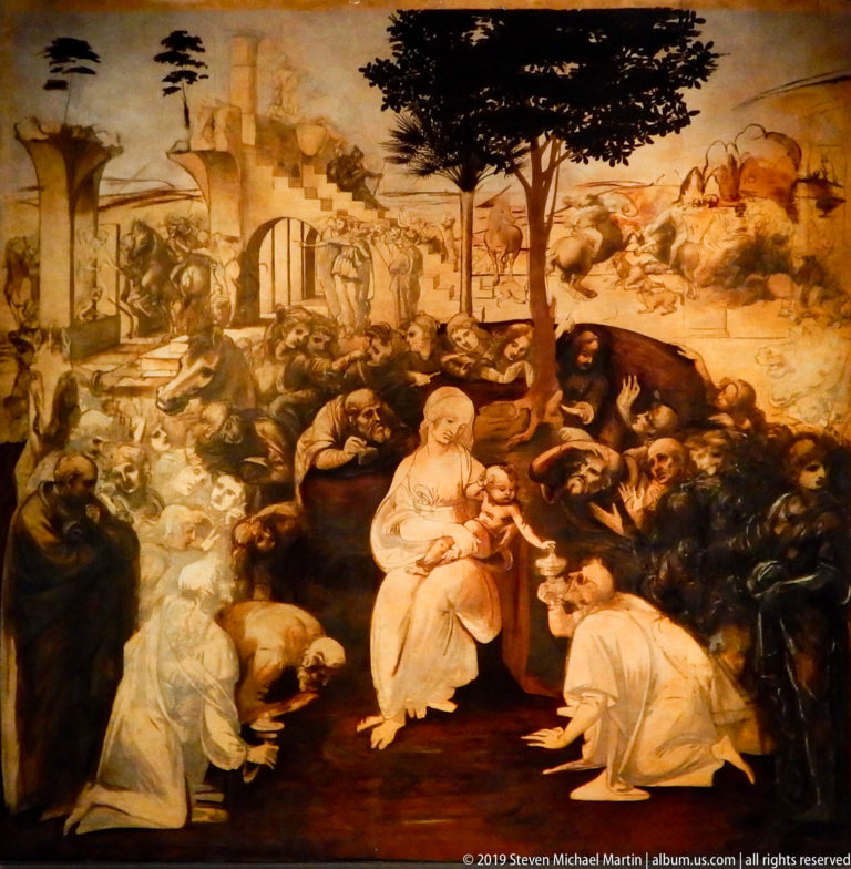 Closer detail of Leonardo’s unfinished Adoration of the Magi centered on the Virgin and Child beneath a tree and surrounding worshippers.