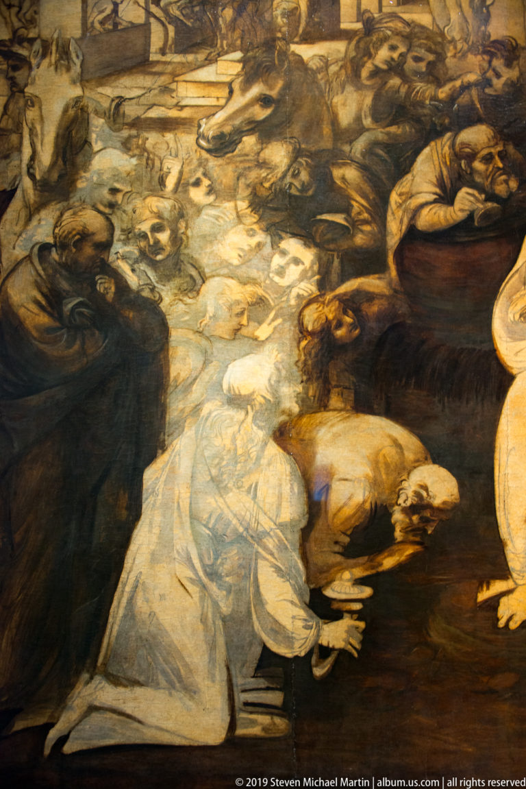Leonardo’s unfinished Adoration of the Magi, with the Virgin and Child amid a dense brown-toned crowd of worshippers and horses.