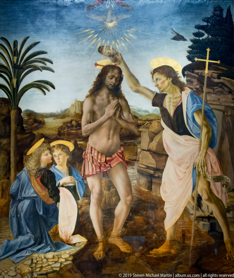 Christ stands in the Jordan as John baptizes him, with two kneeling angels and the Holy Spirit descending above.