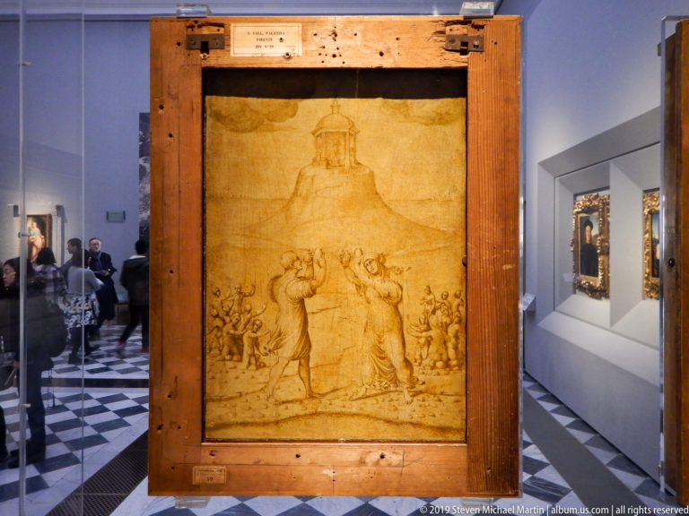 Large brown-line Renaissance drawing with a central standing figure, displayed upright in a heavy wooden conservation frame.