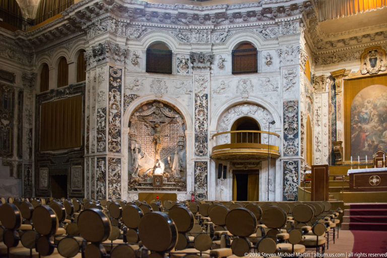 The church’s central altar is framed by carved columns, gilding and painted decoration.
