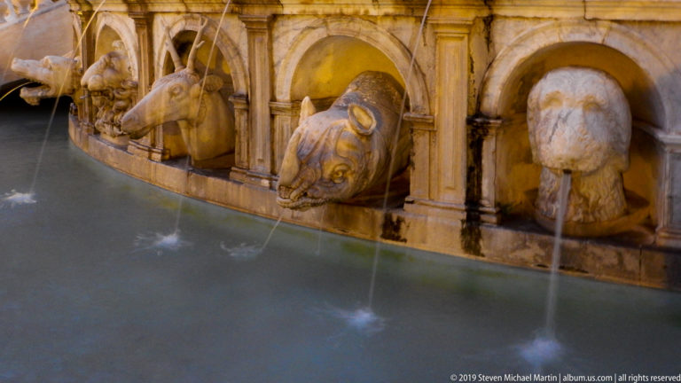 Water jets arc from carved spouts along Fontana Pretoria’s sculpted stone basin.