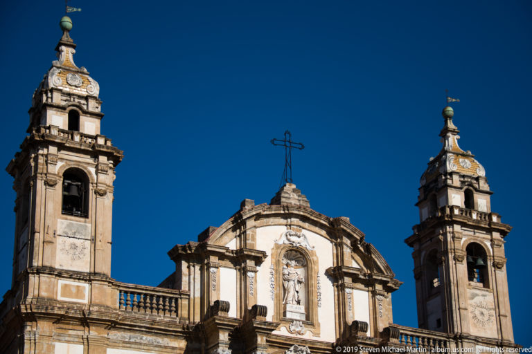 San Domenico’s pale façade and twin bell towers rise above the surrounding Palermo streets.