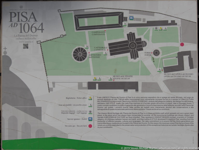Visitor map of Piazza del Duomo showing the cathedral, baptistery, campanile, Camposanto, museums, paths, and information text.