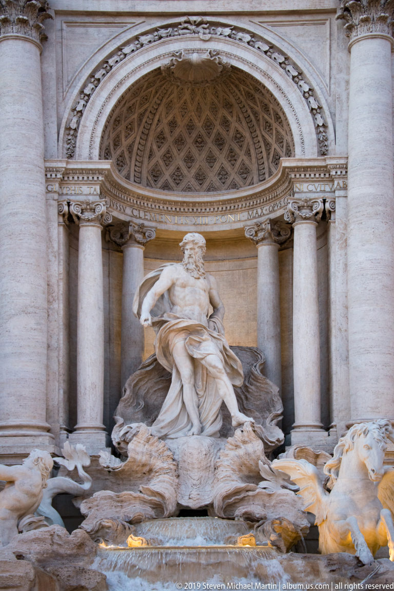 Central Trevi Fountain niche with Oceanus framed by columns and a coffered apse above rocky waterworks.