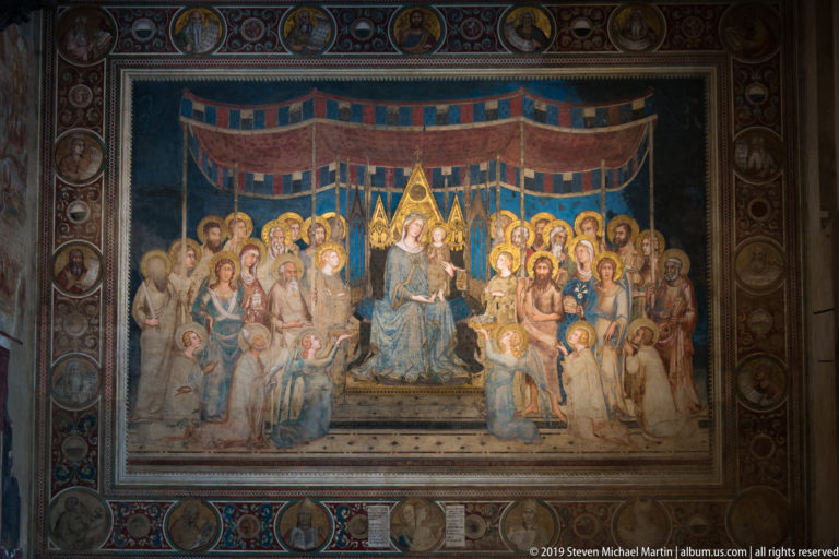 Simone Martini’s Maestà with enthroned Madonna and Child beneath a striped canopy, surrounded by rows of saints and angels.