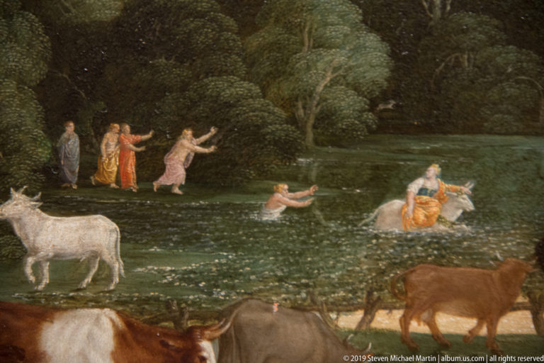 Painted landscape detail with people and cattle wading through shallow water beside a wooded bank.