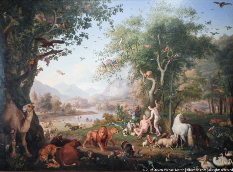 Expansive painted landscape filled with lions, cattle, birds, and other animals around trees and water, with small human figures near center.