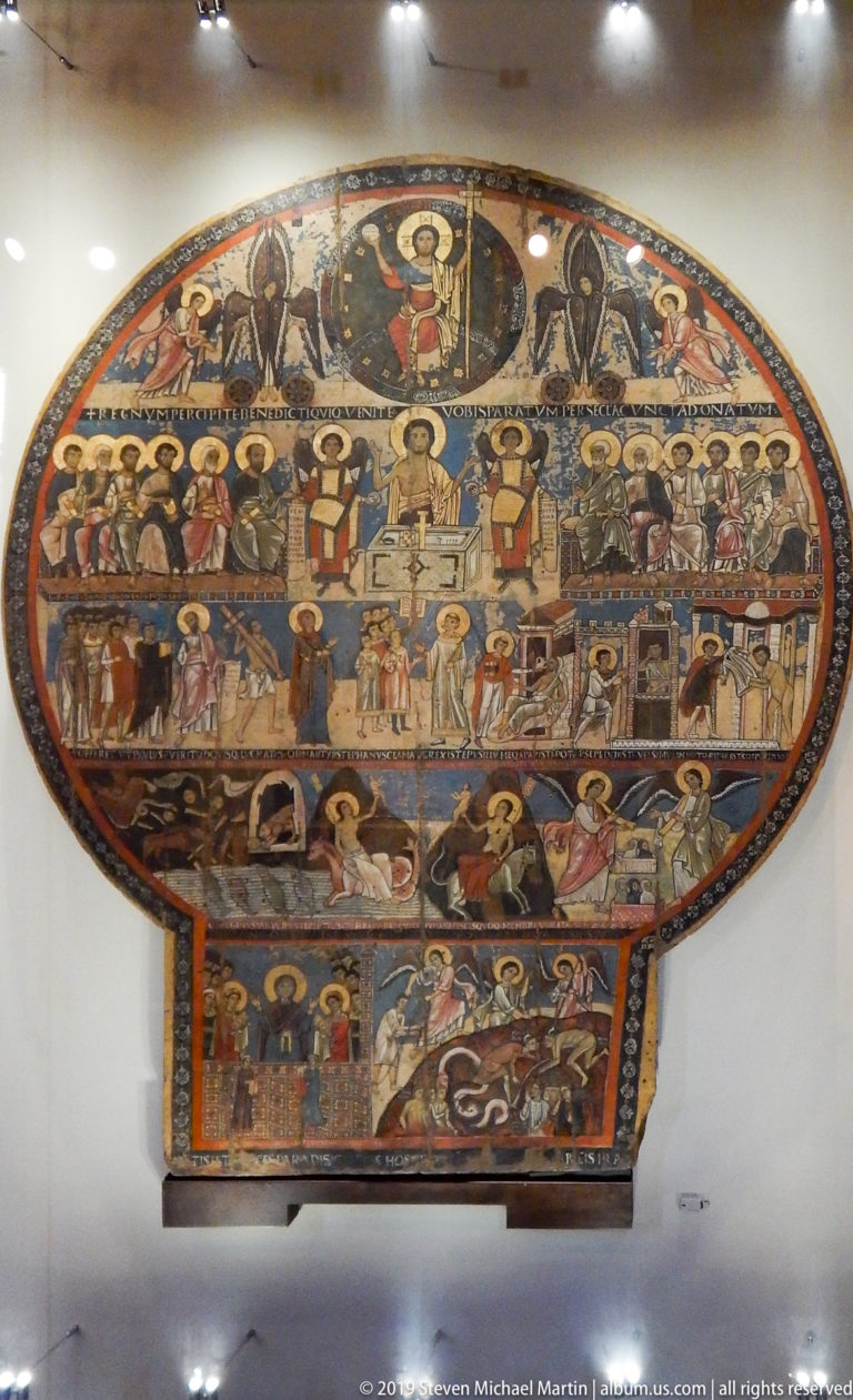 Semicircular medieval mosaic with a central sacred figure above rows of saints and smaller narrative scenes.