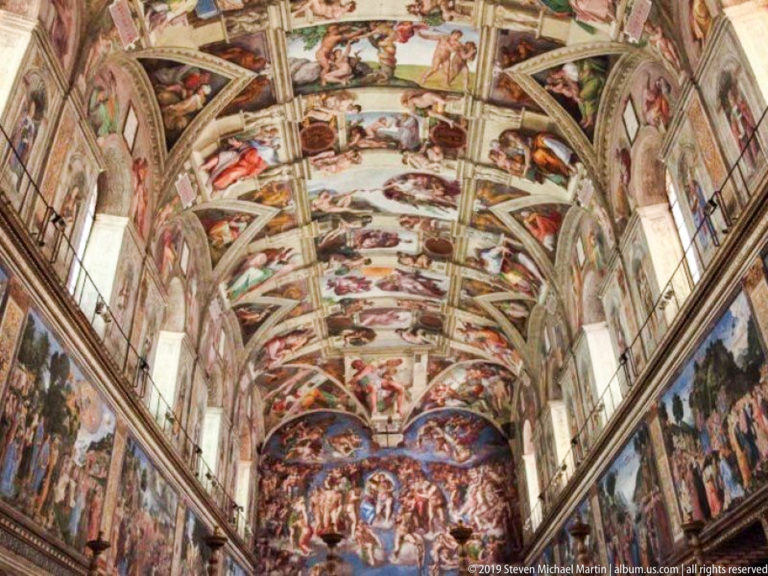 Sistine Chapel interior showing Michelangelo's frescoed ceiling, the Last Judgment on the altar wall, and painted side walls.