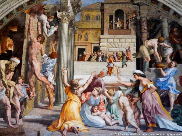 Crowded Renaissance fresco with a nearly nude male figure at left, surrounded by soldiers, women, children, and classical architecture.