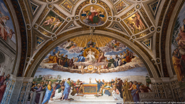 Raphael's Disputation of the Holy Sacrament with an altar and gathered figures below a heavenly assembly of Christ, saints, and angels.