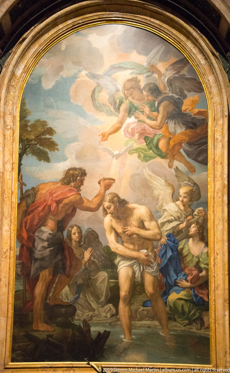 Arched Baptism of Christ mosaic showing Christ in the Jordan before John the Baptist with angels and attendants.