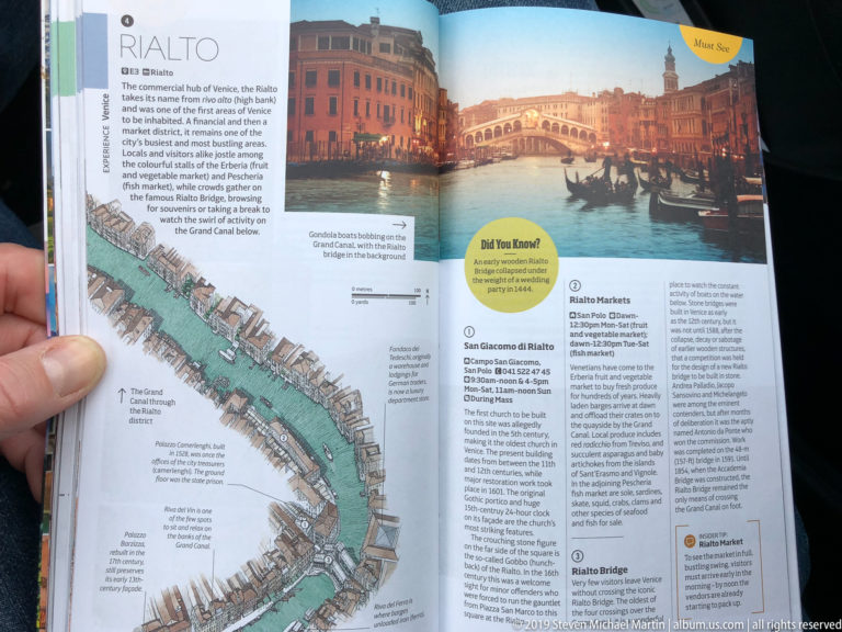 Open Venice guidebook showing an illustrated Grand Canal map, a Rialto Bridge photograph, and visitor information.