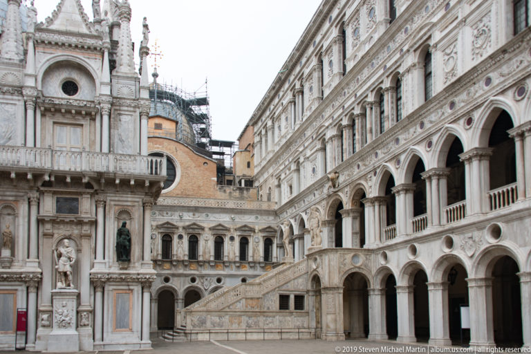 Scala dei Giganti staircase rising through the ornate arcaded courtyard of the Doge’s Palace in Venice.