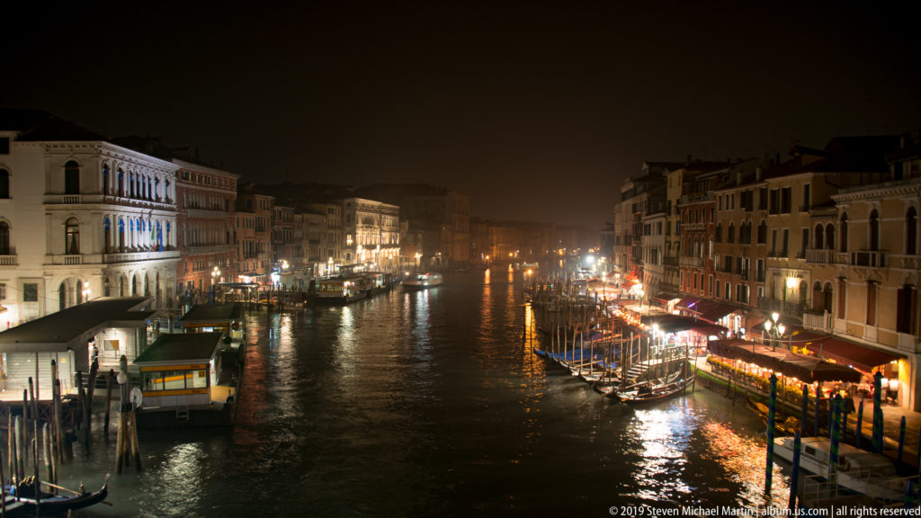 Elevated night view along the Grand Canal under nighttime illumination in Venice.