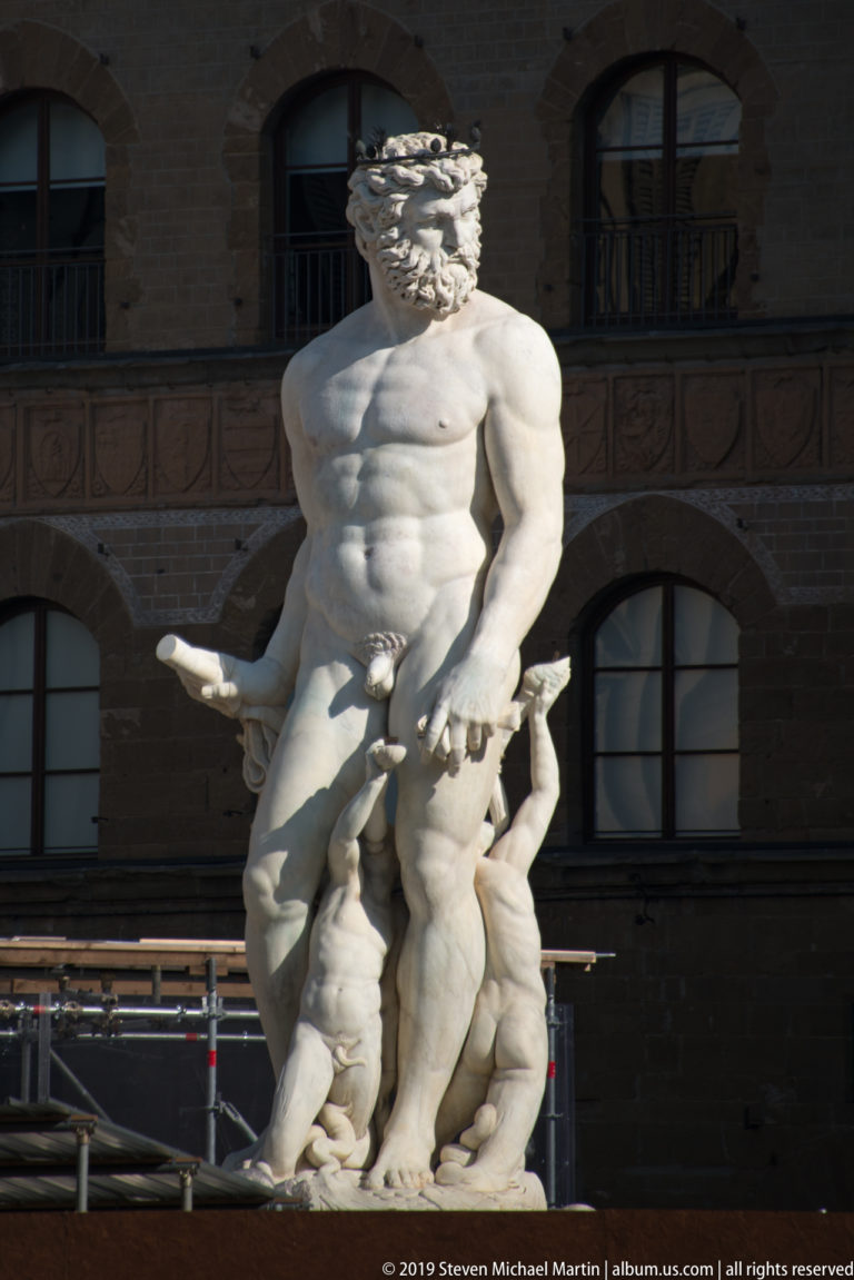 Close frontal view of the marble Hercules figure in Bandinelli’s Hercules and Cacus group outside Palazzo Vecchio.