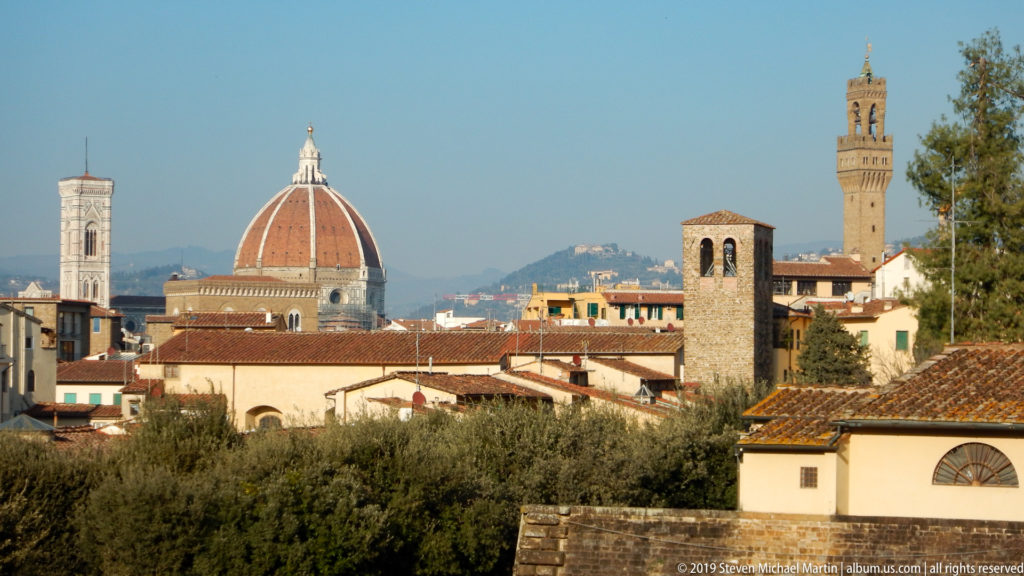 Florence skyline with Brunelleschi’s dome, Giotto’s Campanile, Palazzo Vecchio tower, and terracotta rooftops.