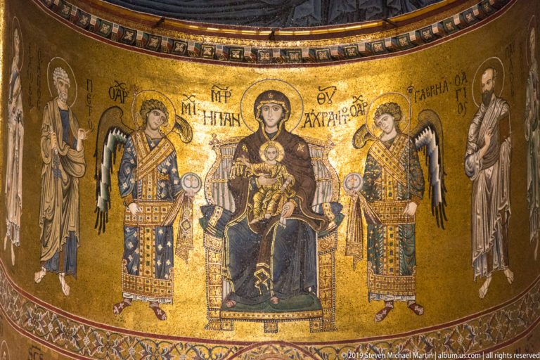 The Virgin enthroned with the Christ Child below Christ Pantocrator in the cathedral apse mosaic.