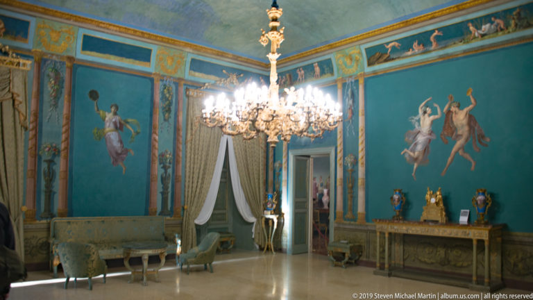Oblique view of the blue chandelier-lit state room.