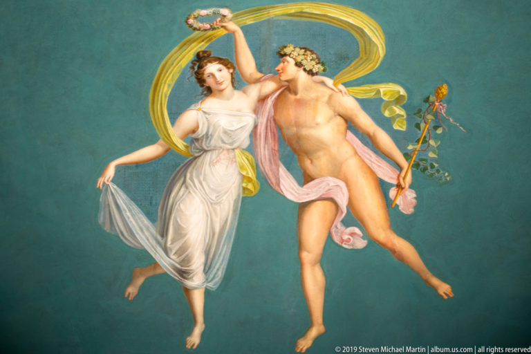 Dancing classical couple in a mythological wall painting.