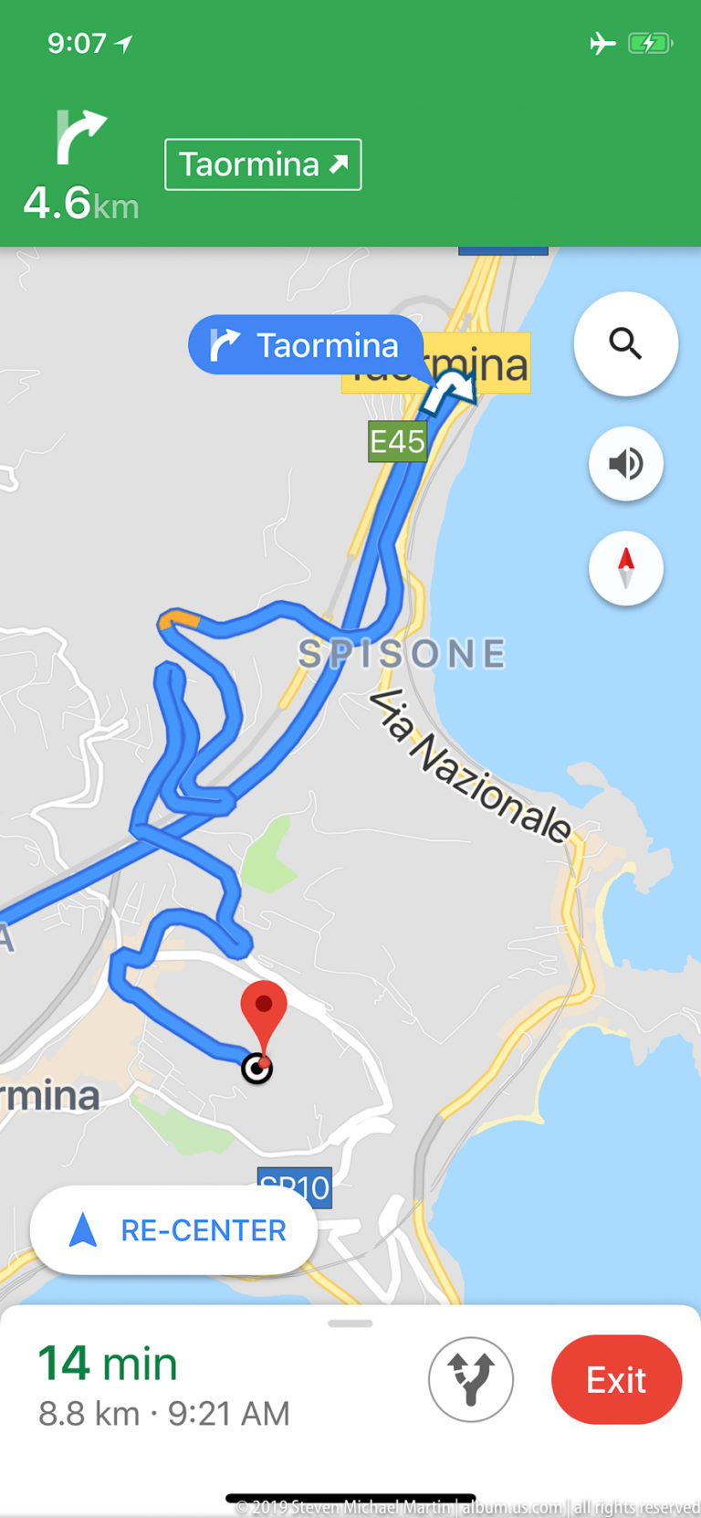 Navigation screen showing a winding blue route toward Taormina, with E45, SS10, coastline, and a fourteen-minute estimate.