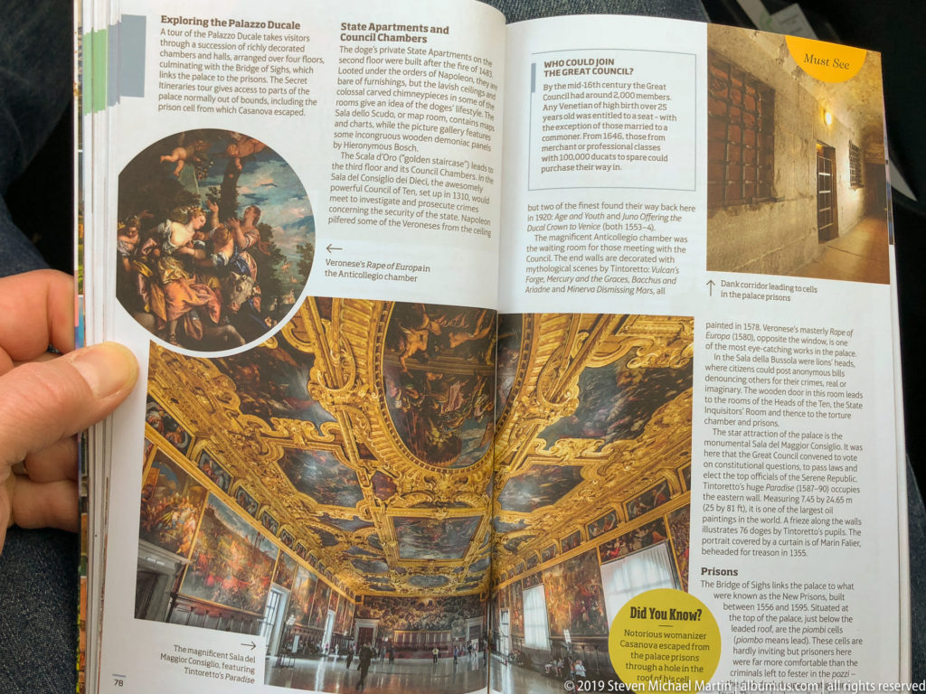 Open guidebook with interior photographs, artwork reproductions, columns of text, and highlighted informational boxes.