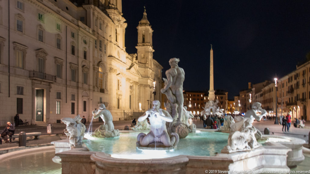 Fountain of Neptune in the foreground with Sant’Agnese in Agone and the Four Rivers obelisk farther down Piazza Navona.