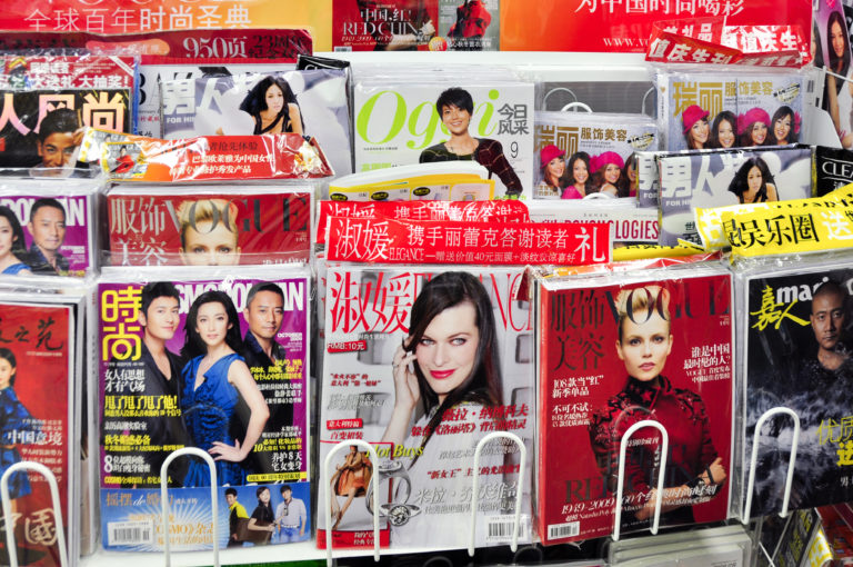 Newsstand rack in Beijing filled with Chinese-language fashion and entertainment magazines in 2009.