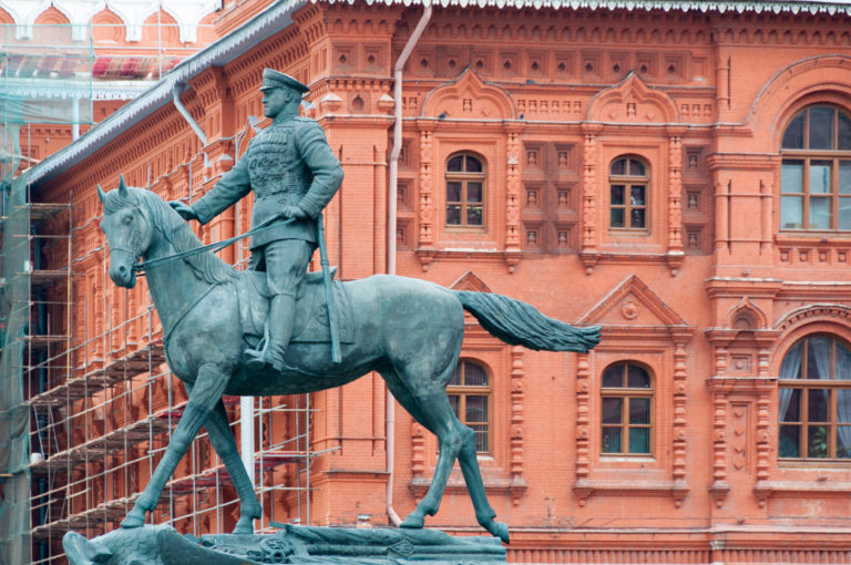 Bronze equestrian statue of Marshal Georgy Zhukov in front of the red-brick State Historical Museum near Red Square.