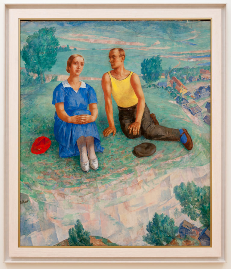 Kuzma Petrov-Vodkin’s 1935 Spring, with a woman in blue and a man in yellow seated above a steeply tilted village landscape.