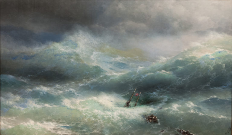 Ivan Aivazovsky’s 1889 Wave, with a wrecked ship and tiny sailors nearly engulfed by enormous gray-green waves beneath dark clouds.