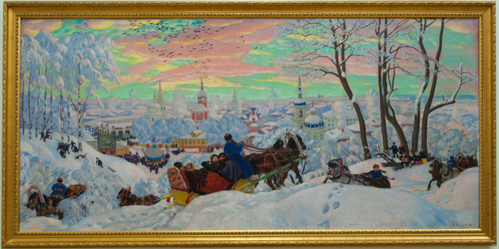 Boris Kustodiev’s 1916 Shrovetide, with a horse-drawn sleigh descending a snowy hill above crowds, churches, and a colorful town.