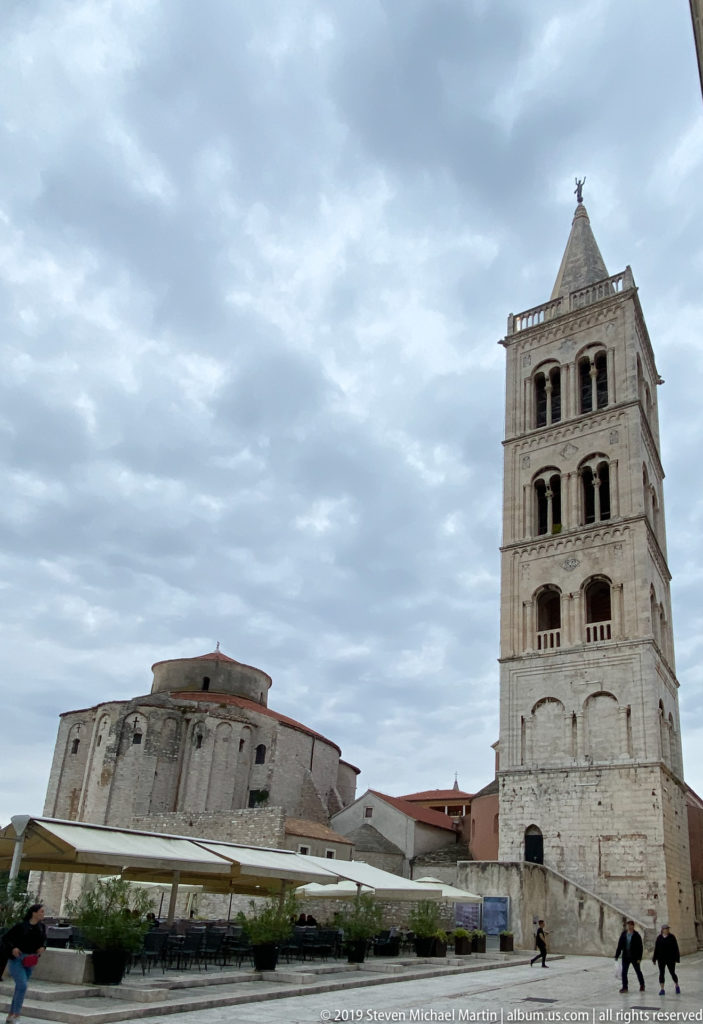 Church of St. Donatus and the tall bell tower of St. Anastasia Cathedral beside the Roman Forum in Zadar.