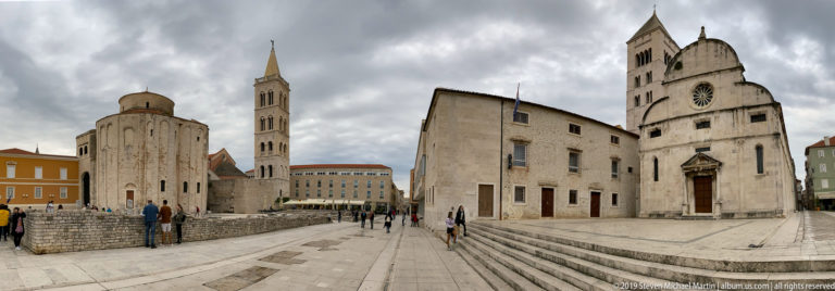 Roman Forum in Zadar with St. Donatus, a bell tower, St. Mary’s Church, and ancient stone remains.