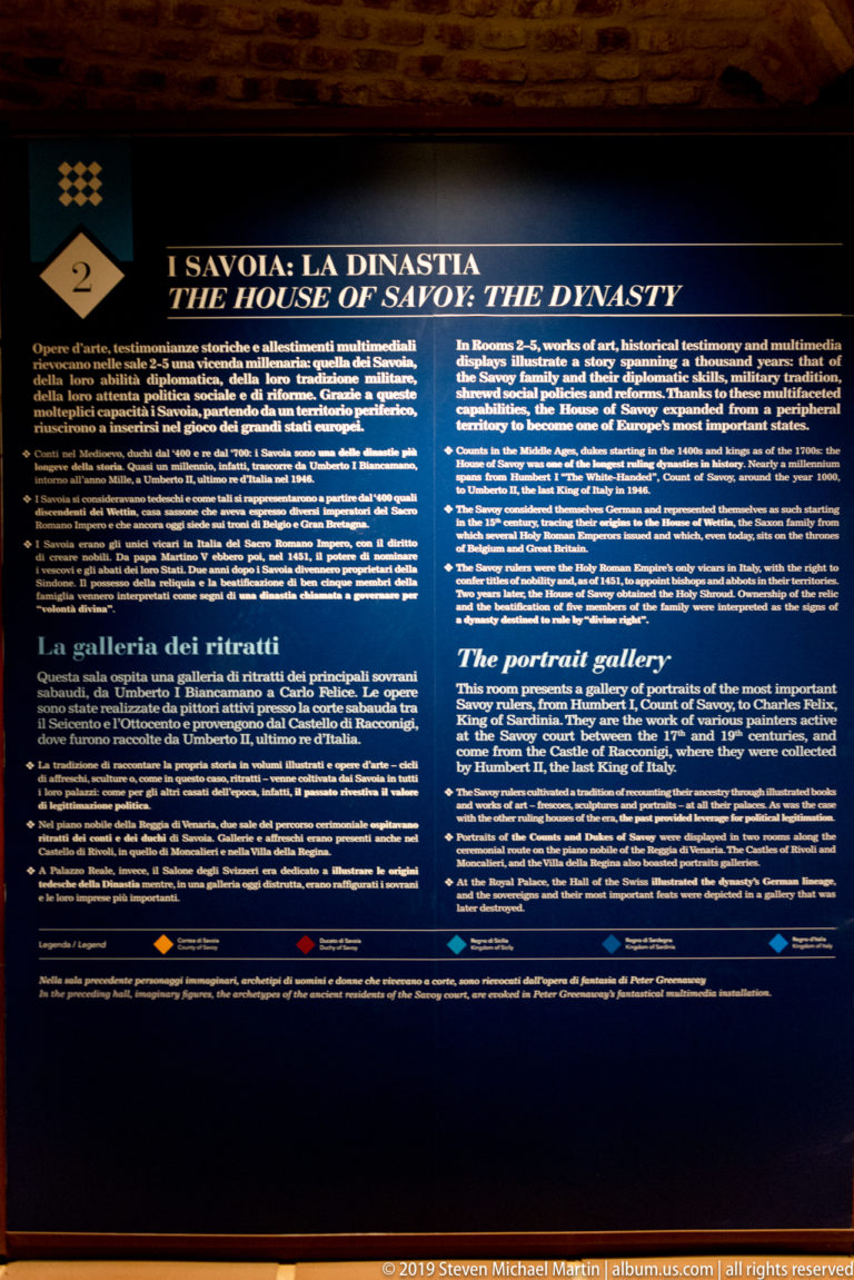 Dark bilingual exhibition panel introducing the House of Savoy dynasty and its portrait gallery.