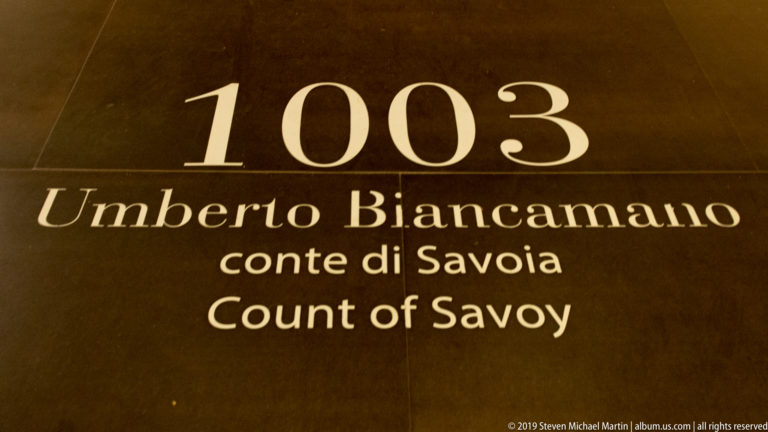 Wall chronology reading “1003 Umberto Biancamano, conte di Savoia, Count of Savoy.”