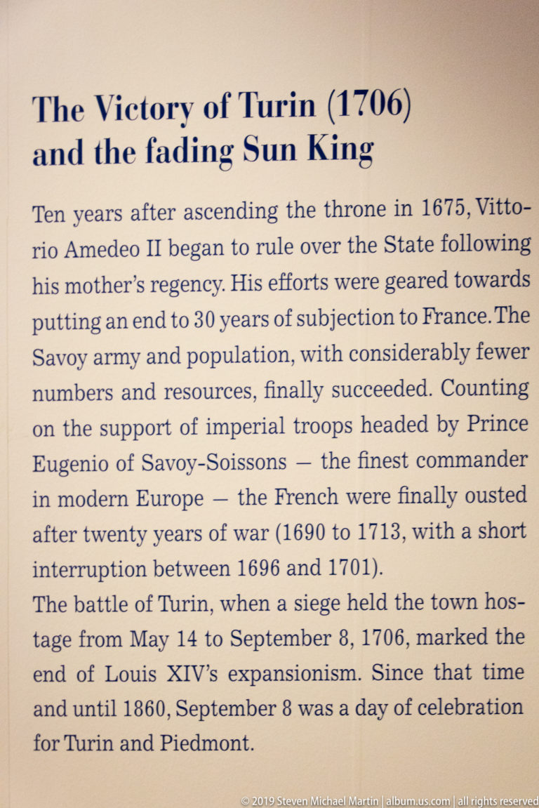 Close view of English museum text discussing Vittorio Amedeo II, the Battle of Turin, and the 1706 siege.