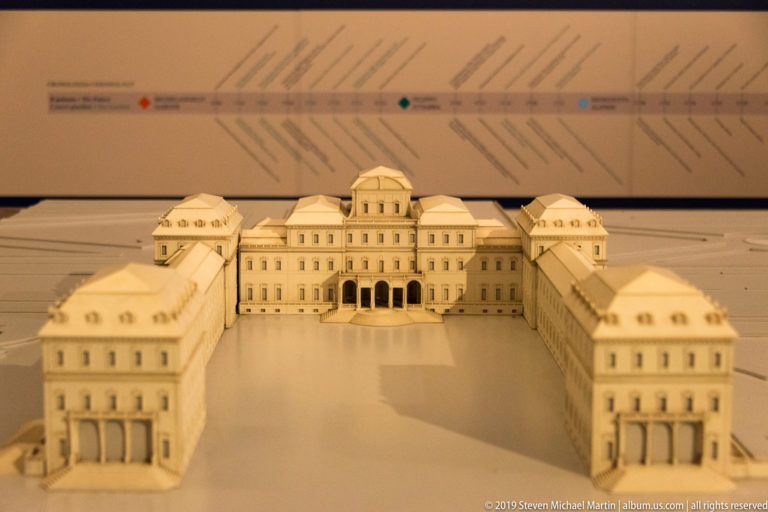 Architectural model of a symmetrical palace complex with central domed block, forecourt, and projecting wings.
