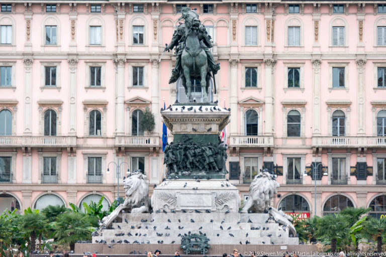 Equestrian monument to Victor Emmanuel II on a tall decorated pedestal in Milan’s Piazza del Duomo.