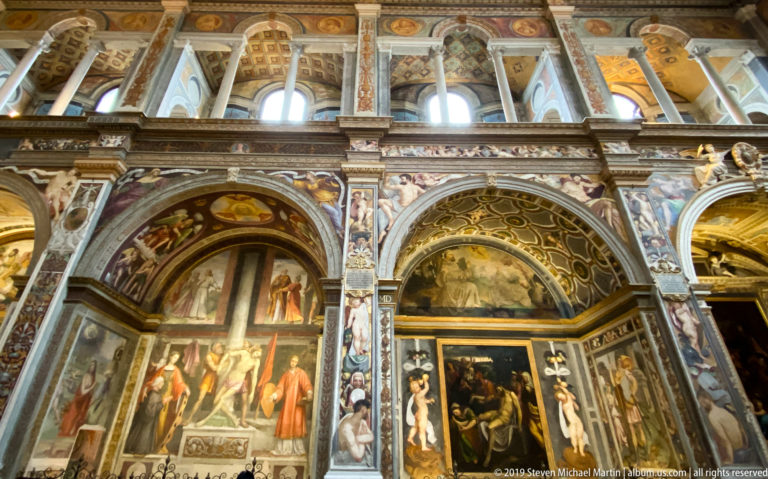 Fresco-covered chapels and arcades inside San Maurizio al Monastero Maggiore in Milan.